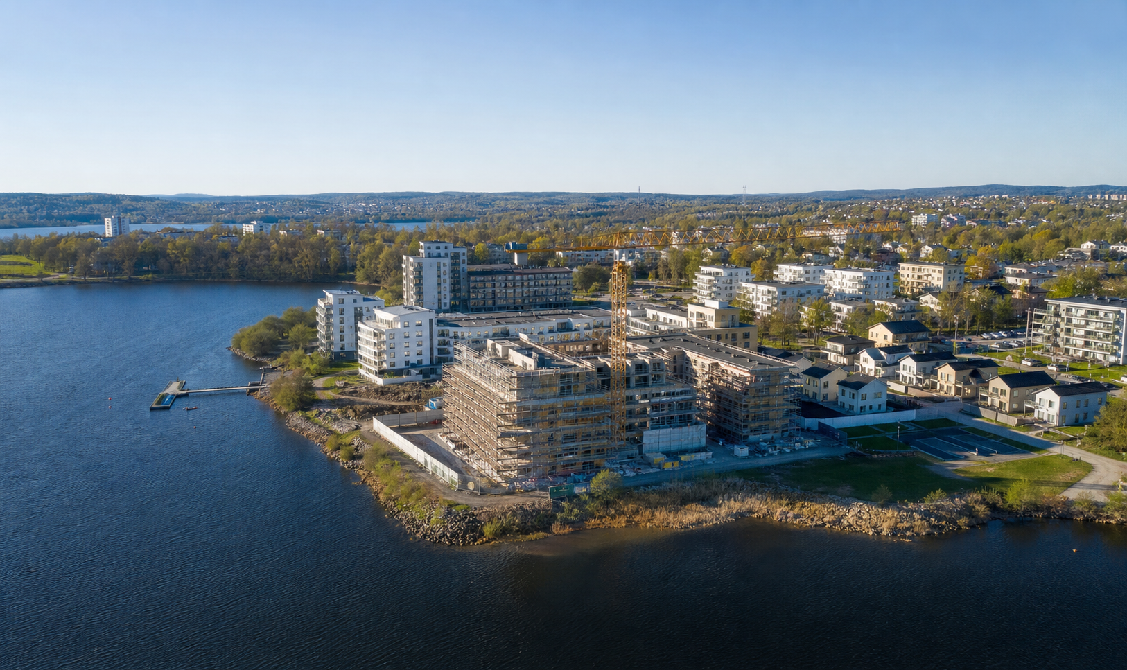 Suburban Waterfront Architecture with Scaffolding and Lake